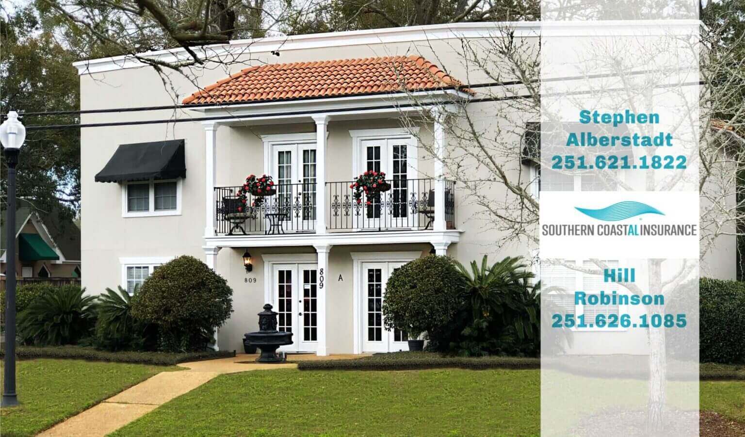 White two-story house with balcony and red roof tiles. White two-story house with balcony and red roof tiles.